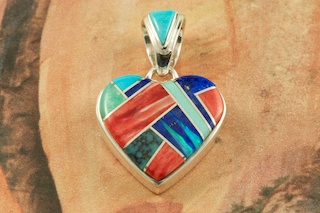 Stunning Heart Pendant featuring Genuine Sleeping Beauty Turquoise, Spiny Oyster Shell and Blue Lapis inlaid between ribbons of Sterling Silver. Accented with Fire and Ice Lab Opals. Free 18